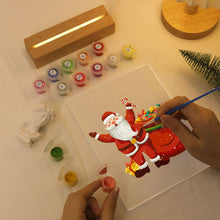 Laden Sie das Bild in den Galerie-Viewer, LED Präsentationssockel aus Holz Malen nach Zahlen 15x20 cm - Weihnachtsmann 08